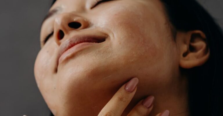 Exfoliants - A Woman Touching Her Neck with Her Eyes Closed